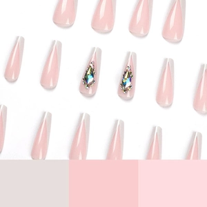 Long coffin french press-on nails in nude pink with sparkling rainbow rhinestones