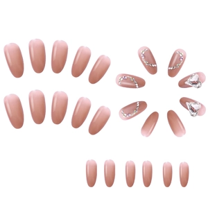 Pink gradient oval press-on nails with rhinestone hearts and glittering line accents