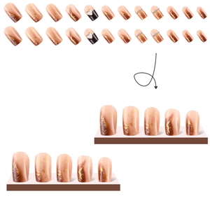 Nude pink gradient press-on nails with gold foil, heart patterns, and rhinestones set