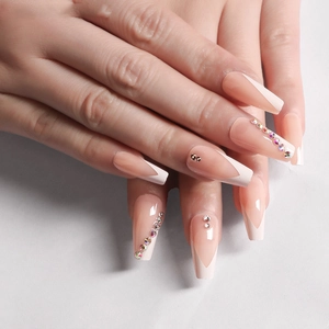 Long coffin press-on nails with white French tips and colorful rhinestone accents