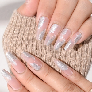 Elegant nude pink press-on nails with silver glitter in ballerina shape design