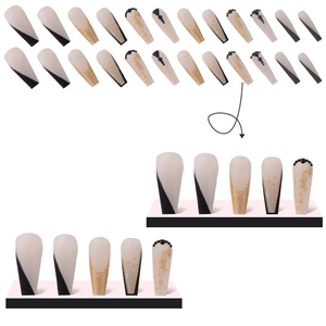 Faux ongles longs trapèze avec feuille d'or, strass et motifs géométriques noirs