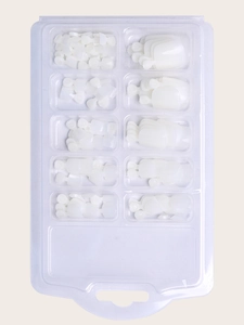 Set of 100 white toe nail tips in a 10-grid transparent storage box for pedicures