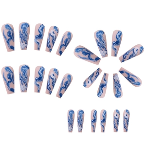 Long coffin press-on nails with blue and white marble ink smudge design on nude base