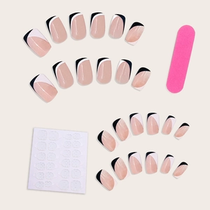 Minimalist French press-on nails set with black and white tips and application tools