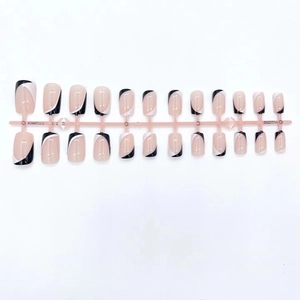 Detail of 24pcs minimalist black and white french press-on nails on storage rack