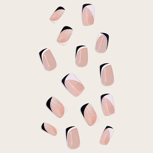 Short French style press-on nails set with black and white geometric asymmetric designs