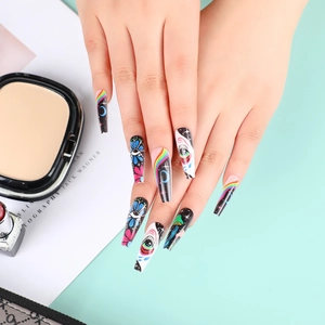 Long trapezoid press-on nails featuring colorful eye and moon art on black base
