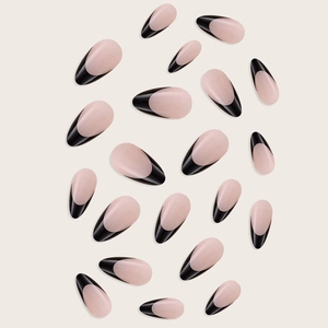 French tip almond press-on nails with sleek black edges on a soft pink base