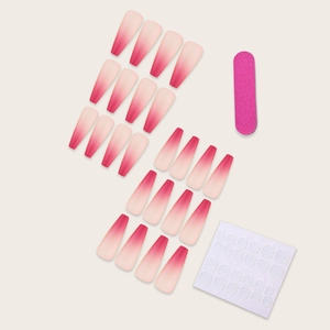 Long coffin-shaped matte ombre press-on nails in pink and nude with tools