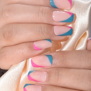 French tip press-on nails with geometric pink and blue contrast on natural nude base