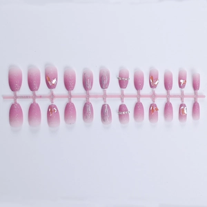 Detail of 24pcs pink gradient press-on nails with silver glitter and 3D rhinestones