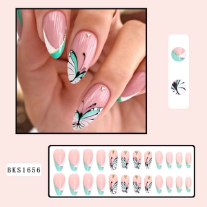 Almond-shaped press-on nails with mint green butterfly patterns and French tip designs