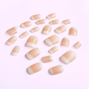 Glossy French manicure press-on nails with nude pink base and classic white tips
