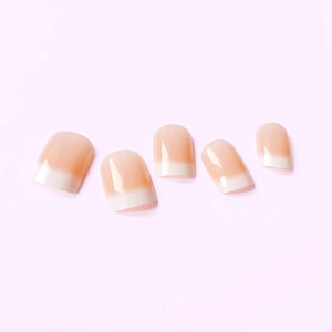 Glossy nude pink ombre press-on nails in a short square shape with high-shine finish