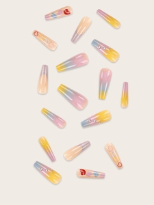 Detailed view of long coffin press-on nails with heart, lip patterns and rhinestones