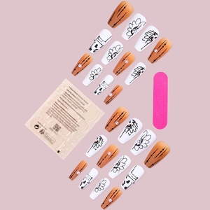 Kit de 24 faux ongles mats orange et blanc avec motifs floraux et perles chic