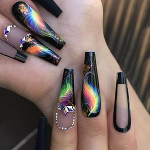 Long coffin press-on nails with dark neon feather art and sparkling rhinestone chains