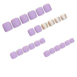 Matte lavender and glitter gold press-on toenails set on a clean white background