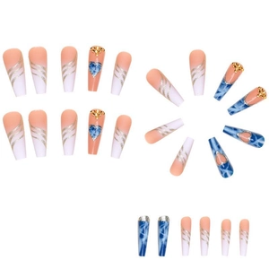 Long coffin press-on nails with blue marble hearts, nude gradient, and gold glitter