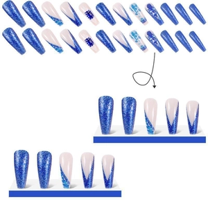 Blue glitter long coffin nails set with rhinestones and marble patterns on white background