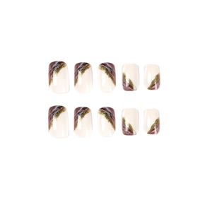 Detail view of square marble effect press-on nails with gold leaf and beige accents