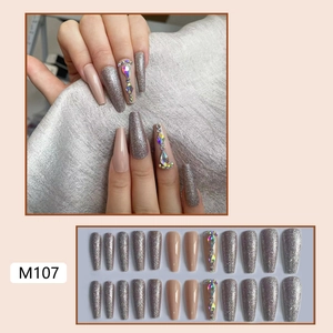 Long coffin press-on nails in silver glitter and nude pink with rhinestones and pearls