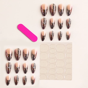 French almond press-on nails with black rose patterns and rhinestones on nude base