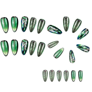 Detail view of almond press-on nails with green glitter, flame patterns, and small rhinestones