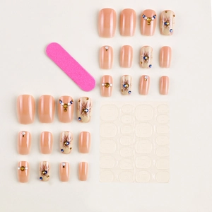 Faux ongles amande nude avec motifs floraux élégants et strass brillants en kit complet