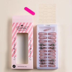 Christmas press-on nail kit with pink base, snowflake art, and Coffin shape tips