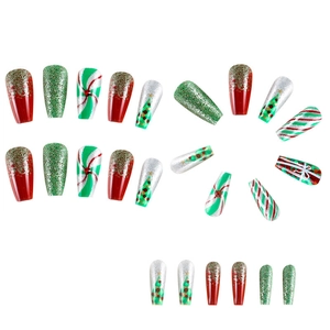 Christmas themed press-on nails with red green glitter and festive tree patterns