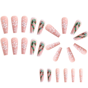 Christmas press-on nails with long coffin shape, featuring snowflakes and festive vine designs