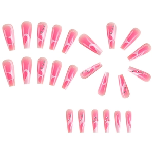 Long coffin press-on nails with pink gradient, white swirls, and small rhinestone accents