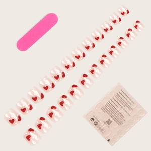 Toenail press-on set with red heart and white polka dot patterns on clear base