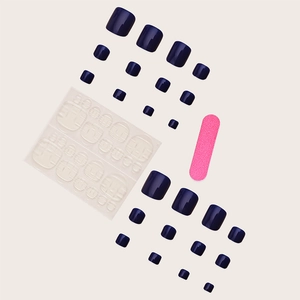 Navy blue press-on toenails kit including multiple size tips, jelly glue, and a pink file