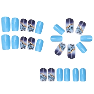 Blue ink marble press-on nails set with gold glitter lines and solid blue glossy finish