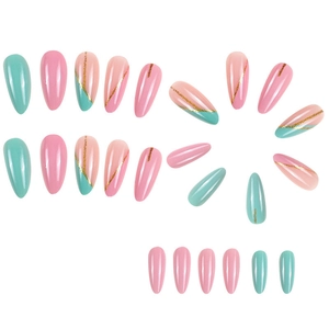 Macro shot of almond-shaped press-on nails with pink, blue colors and gold glitter stripes