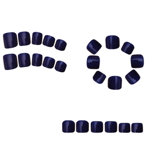 Detail view of 96-piece glossy navy blue press-on toenails in various sizes on white back