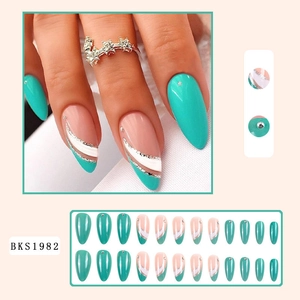 Detailed view of mint green almond press-on nails with glitter and rhinestone accents