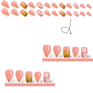 Macro view of square daisy press-on nails with gold glitter and pink floral patterns
