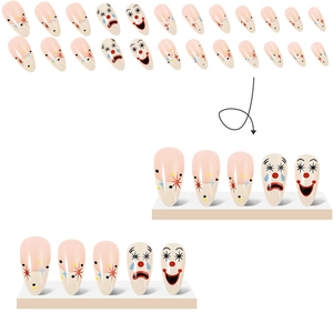 Almond press-on nails with circus clown patterns and black-red stars in nude pink