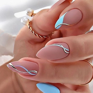 Close-up of almond nails with dusty pink base, light blue and silver wavy line art