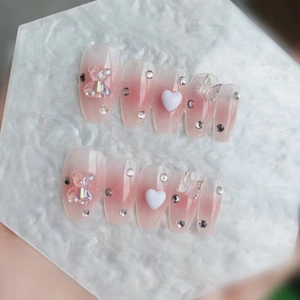 Pink gradient press-on nails with 3D resin bear, butterfly and crystal accents