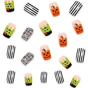 Detail of Halloween press-on nails featuring pumpkin, Frankenstein and mummy designs