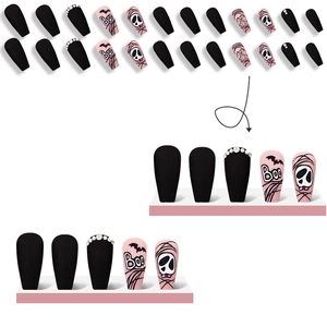 Halloween press-on nails with black matte, pink bats and skull designs with rhinestones