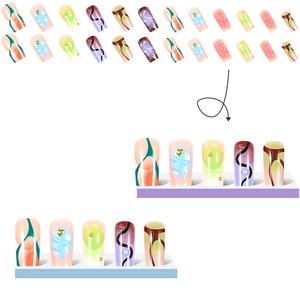 Close-up of long trapezoid press-on nails with 3D gold hearts and marble textures