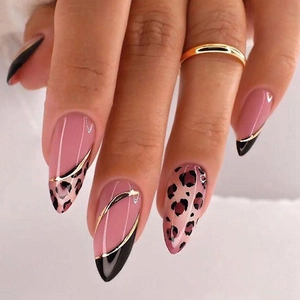 Pink and black almond press-on nails with leopard print and gold metal line details