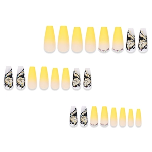Macro view of long coffin press-on nails with yellow gradient and 3D butterfly designs