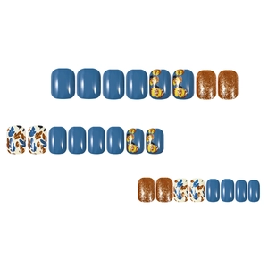 Detail view of 24pcs autumn press-on nails with blue, bronze glitter, and leaf patterns